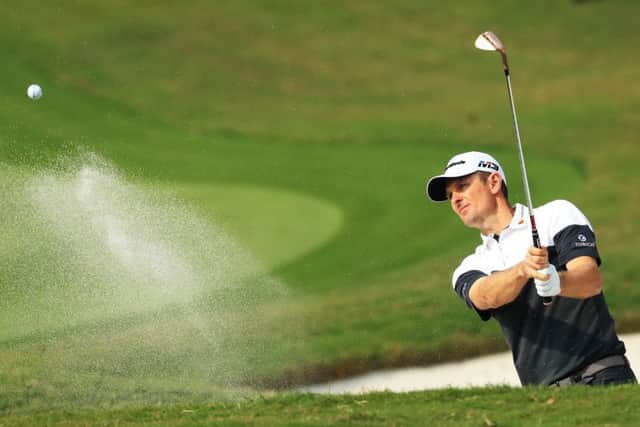 Justin Rose plays out of a bunker at the ninth hole during his second round in Shanghai. Picture: Getty.