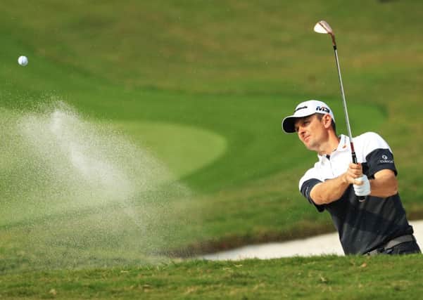 Justin Rose plays out of a bunker at the ninth hole during his second round in Shanghai. Picture: Getty.