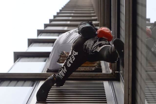 Daredevil climber Alain Robert, dubbed the French Spiderman, scales the outside of the Heron Tower in London. Picture: Kirsty O'Connor/PA Wire