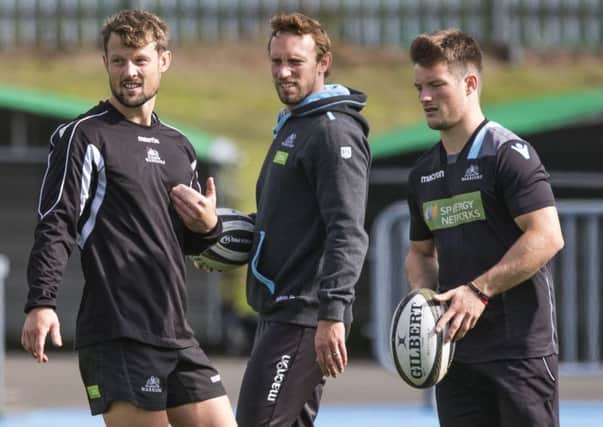 Peter Horne, left, and George Horne, right, with Glasgow kicking coach Mike Blair at training. Picture: Gary Hutchison/SNS/SRU