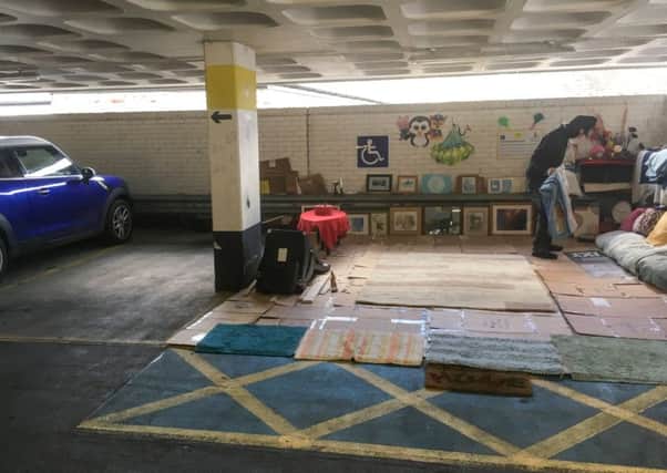 Paul Lindsay-Jones at his makeshift home - created in a car park space. Picture: SWNS.