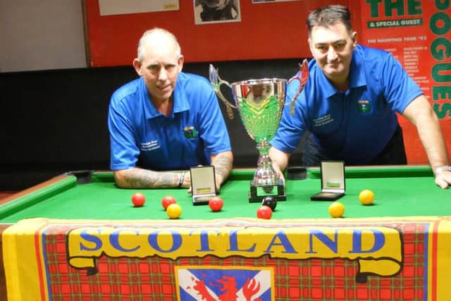 Scotland Masters team members Robert Hoey (left) and Hugh McBride with the European Championship trophy they won earlier this year.