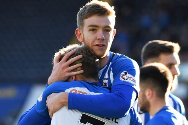 Rory McKenzie celebrates his goal with Scott Boyd