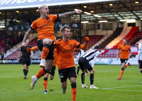 Dundee United's Fraser Aird and Billy King celebrates after King  made it 2-0. Picture: SNS