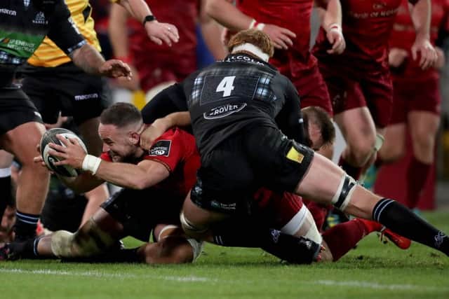 Munsters Alby Mathewson  squeezes through to score a try. Picture: Dan Sheridan/INPHO/REX/Shutterstock.