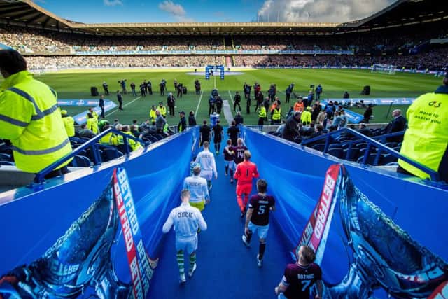 The teams emerge from the tunnel and walk into a vibrant atmosphere at Murrayfield yesterday. Picture: SNS.