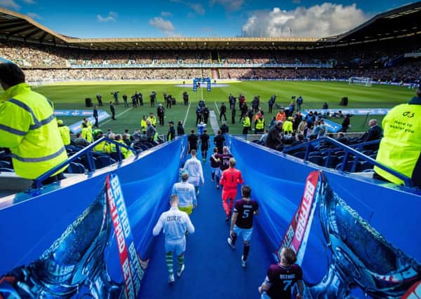 The teams emerge from the tunnel and walk into a vibrant atmosphere at Murrayfield yesterday. Picture: SNS.