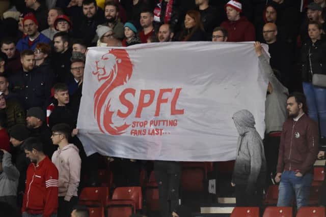 Aberdeen fans take aim at the SPFL. Picture: SNS Group