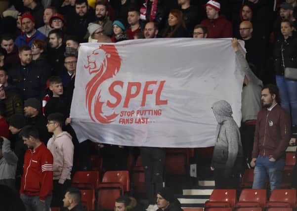 Aberdeen fans take aim at the SPFL. Picture: SNS Group