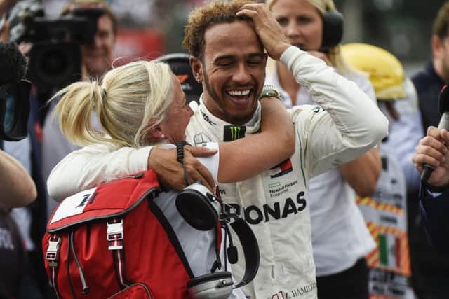 Despite his in-race moans, Lewis Hamilton was all smiles afterwards. Picture: AFP/Getty.