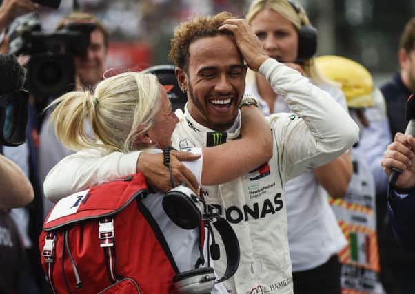 Despite his in-race moans, Lewis Hamilton was all smiles afterwards. Picture: AFP/Getty.