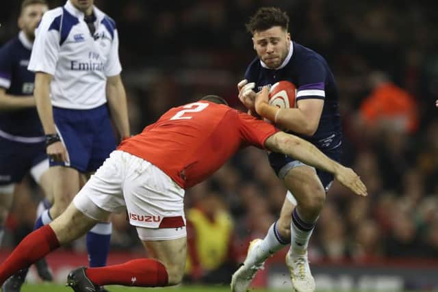 Ali Price is tackled by Ken Owens back in February