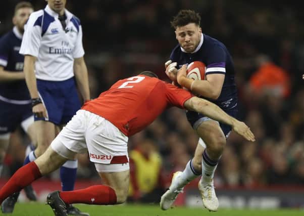 Ali Price is tackled by Ken Owens back in February