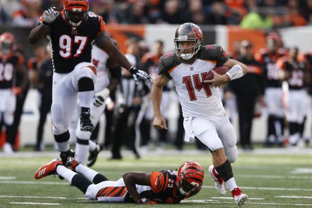 The electrifying Ryan Fitzpatrick gave Cincinnati Bengals a scare by hauling the Buccaneers level. Picture: AP.
