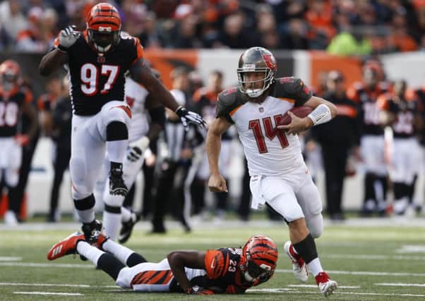 The electrifying Ryan Fitzpatrick gave Cincinnati Bengals a scare by hauling the Buccaneers level. Picture: AP.