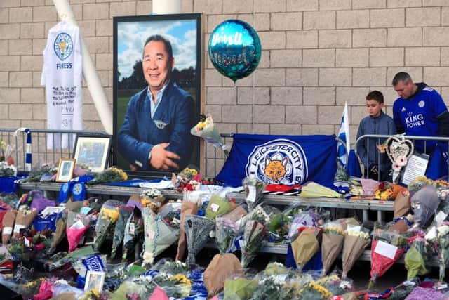 Following the death of Leicester City owner Vichai Srivaddhanaprabha and four others in a helicopter crash last weekend, the clubs King Power Stadium has become a focal point for tributes. Picture: PA.
