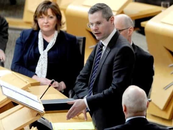 Derek Mackay has hit out at Tory tax cuts for the "richest in society."