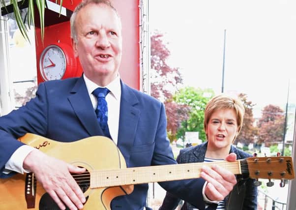 Nicola Sturgeon listens to SNP MP Pete Wishart play guitar, but will she listen to him about the Peoples Vote Brexit campaign? (Picture: Jeff J Mitchell/Getty)