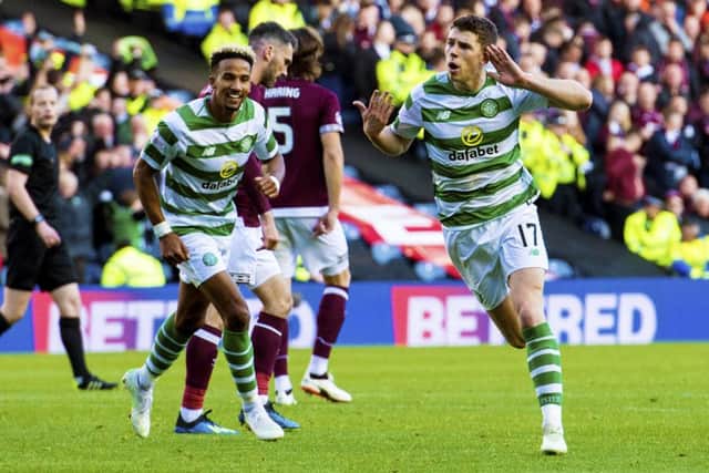 Celtic's Ryan Christie, right, celebrates after scoring the third for his side in their 3-0 Betfred Cup semi-final win over Hearts. Picture: SNS