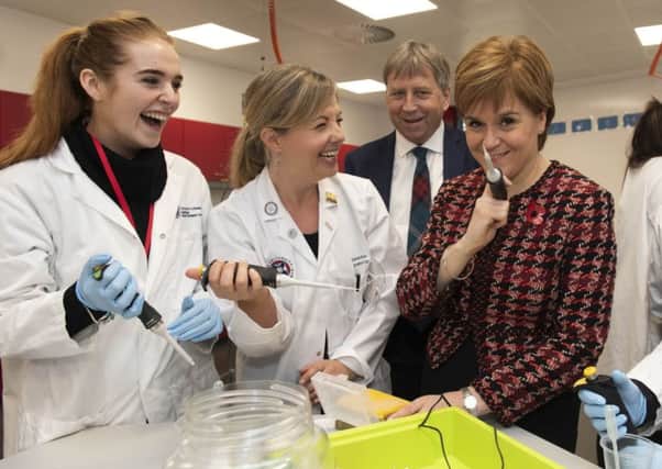 The First Minister met with workers and cut a ribbon with an oversized pair of scissors, she the spent some time with Musselburgh Grammar students in the Science Outreach Centre and met Henrietta the hen (toy)
