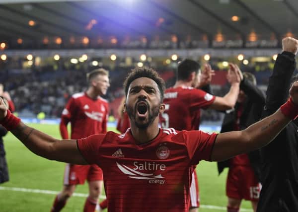 Shay Logan celebrates after Aberdeen defeat Rangers in the Betfred Cup. Picture: SNS