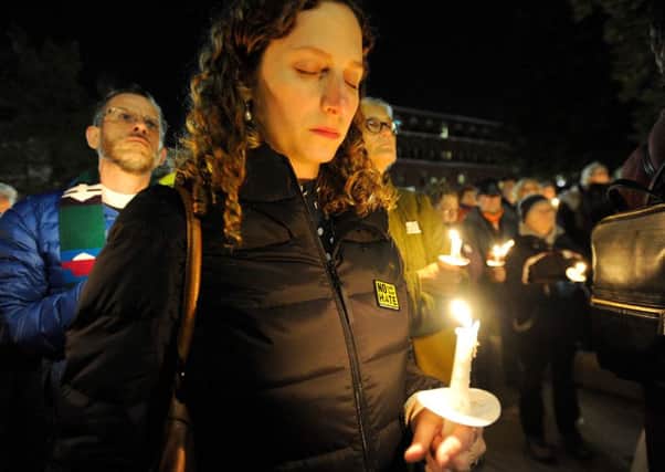 Talia Ben Sasson-Gordis closes her eyes in prayer during a vigil for the victims of the Pittsburgh Synagogue shooting