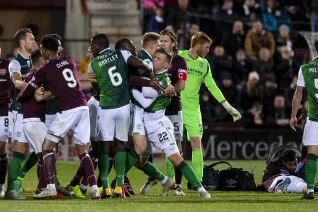Tempers flare after Florain Kamberi's challenge on Ollie Bozanic that led to the Hibs striker's dismissal in the second half.