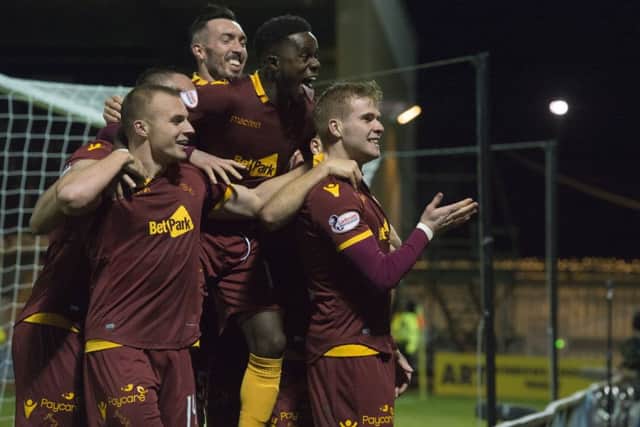 Motherwell midfielder Chris Cadden celebrates making it 2-0. Picture: SNS