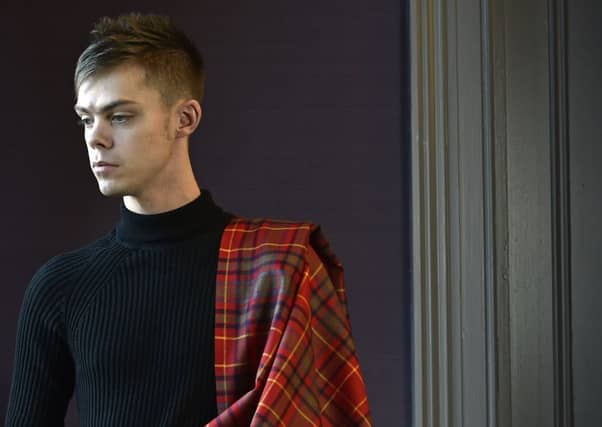 Ellis Urquhart, tourism lecturer at Edinburgh Napier University, is the first to wear the Scotland's War tartan.