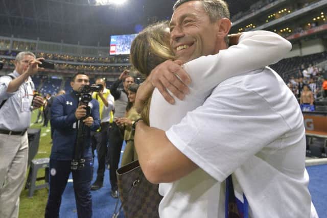 Pedro Caixinha, coach of Cruz Azul, hugs his wife after his team won the Mexican Cup. Picture: Getty Images