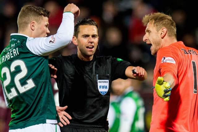 Derby referee Andrew Dallas attempts to diffuse a flashpoint between Hibs' Florian Kamberi and Hearts 'keeper Zdenek Zlamal. Picture: SNS Group