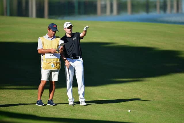 Russell Knox and his caddie weigh up a shot on his way to a 66 in the Turkish Airlines Open. Picture: Stuart Franklin/Getty Images