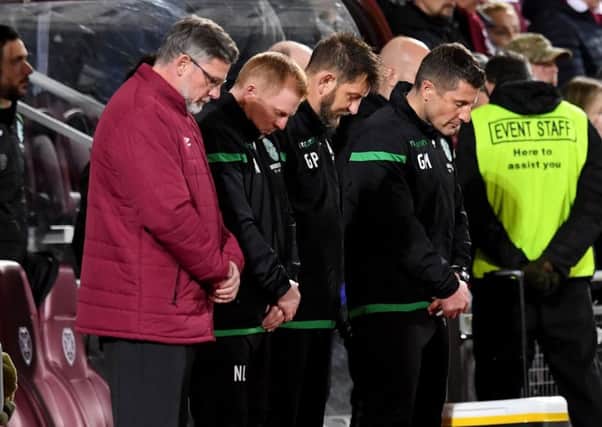 Neil Lennon and Craig Levein stood side by side for a minute's silence in memory of those killed in the Leicester City helicopter crash (Picture: Craig Williamson/SNS)
