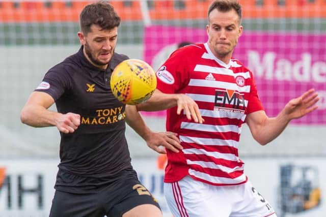 Livingston's Craig Halkett battles with Hamilton striker Fredrik Brustad. Picture: SNS