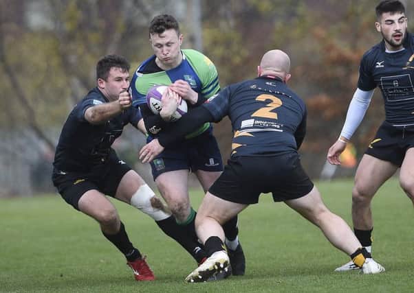 Boroughmuir's Gavin Parker
 tries to find a way through against Currie. Picture: Greg Macvean