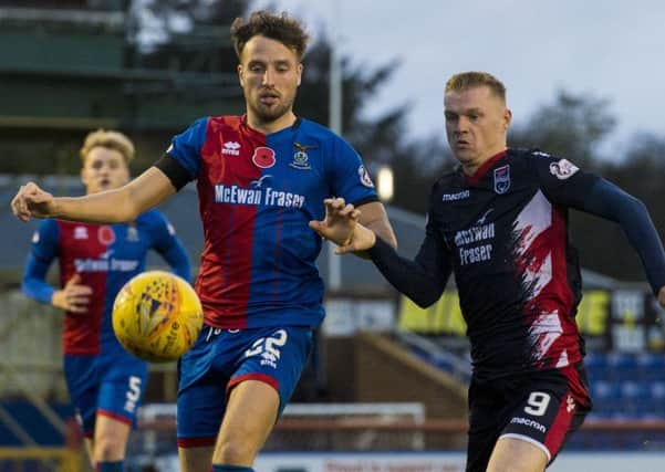 Inverness' Brad McKay (left) battles with Ross County's Billy Mckay. Picture: SNS