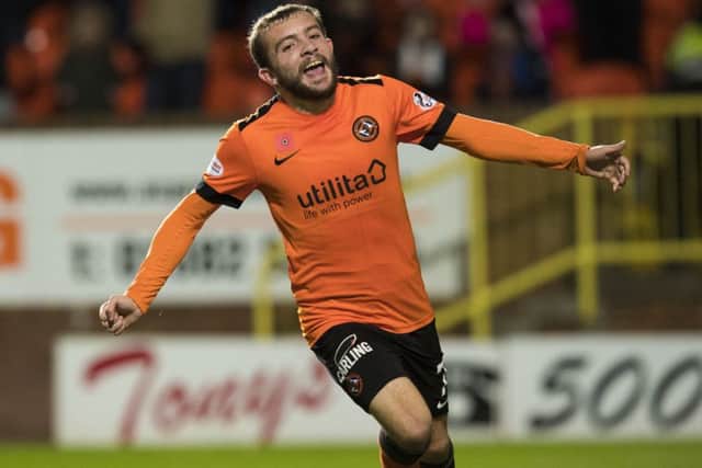 Dundee United's Paul McMullan celebrates after Queen of the South's Michael Doyle's own goal. Picture: SNS