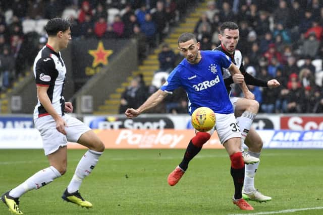 Eros Grezda competes with Paul McGinn of St Mirren. The Rangers winger has vowed to get better with game time. Picture: SNS Group