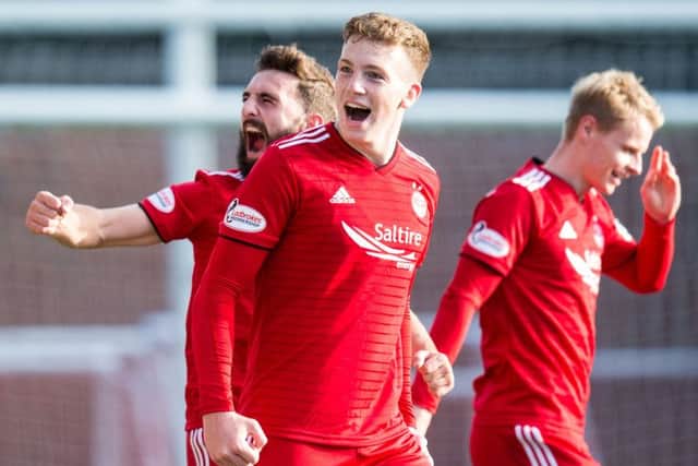 Lewis Ferguson celebrates after his free kick secured the three points for Aberdeen. Picture: SNS Group