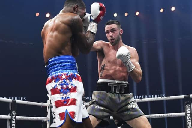 Josh Taylor lands a blow on his way to defeating Ryan Martin. Picture: SNS