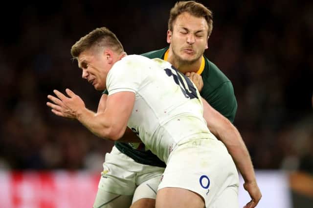 Owen Farrell crashes into South Africa's Andre Esterhuizen with a tackle that has polarised opinion. Picture: Adam Davy/PA Wire