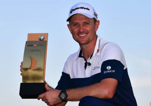 Justin Rose celebrates with the trophy after winning the Turkish Airlines Open for the second year running. Picture: Getty Images