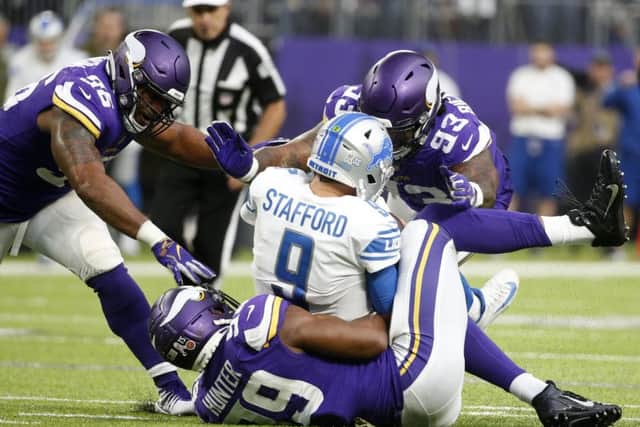 Detroit Lions quarterback Matthew Stafford is sacked by the Minnesota Vikings defence. Picture: Bruce Kluckhohn/AP