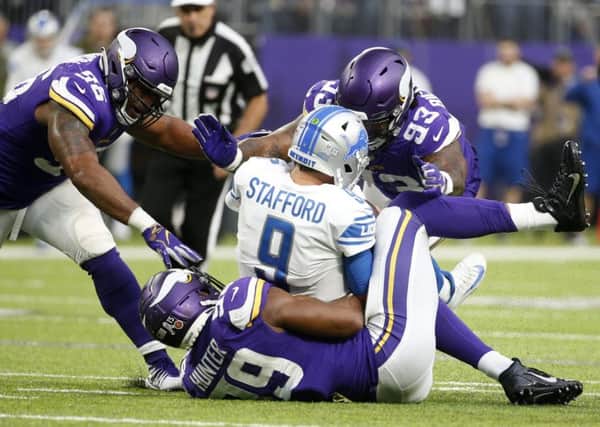 Detroit Lions quarterback Matthew Stafford is sacked by the Minnesota Vikings defence. Picture: Bruce Kluckhohn/AP