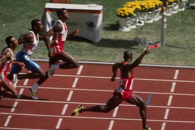 Johnson celebrates as he crosses the finishing line well ahead of Carl Lewis to take 100m gold at the Seoul Olympics in 1988. Picture: Simon Bruty