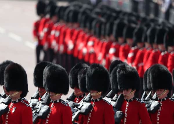 The Coldstream Guards march along Horseguards Parade ahead of the Trooping the Colour event for the Queens birthday (Picture: Daniel Leal-Olivas/AFP/Getty)