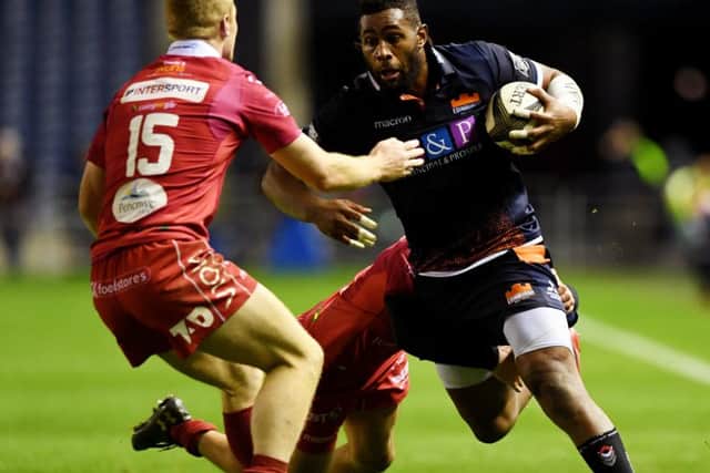 Mata takes on Scarlets' Johnny McNicholl and Ioan Nicholas during a Guiness PRO14 clash. Picture: SNS Group