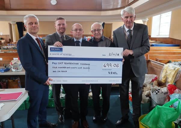 From left: Phil Daws-East Renfrewshire Council Head of Environment, Andy Collins-Rexel, Ryan Thompson-Rexel, Stan Esson-Barrhead Foodbank and Councillor Danny Devlin-Housing and Maintenance Services Convener.