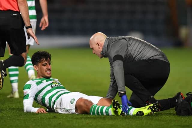 Celtic's Daniel Arzani is stretchered off on his debut. Picture: SNS/Craig Foy
