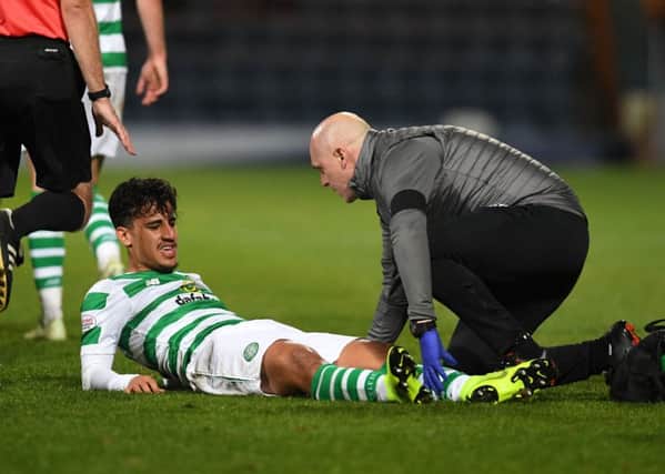 Celtic's Daniel Arzani is stretchered off on his debut. Picture: SNS/Craig Foy